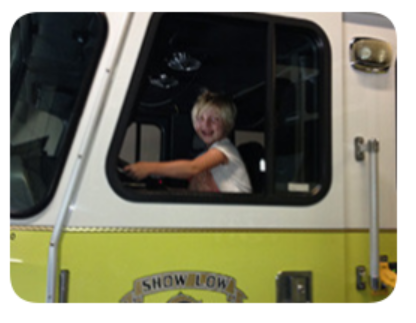 Child in fire truck